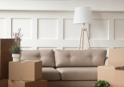 Empty living room with cardboard boxes on moving day