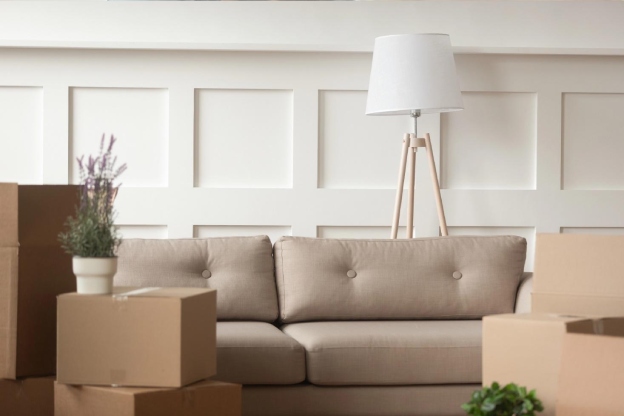 Empty living room with cardboard boxes on moving day
